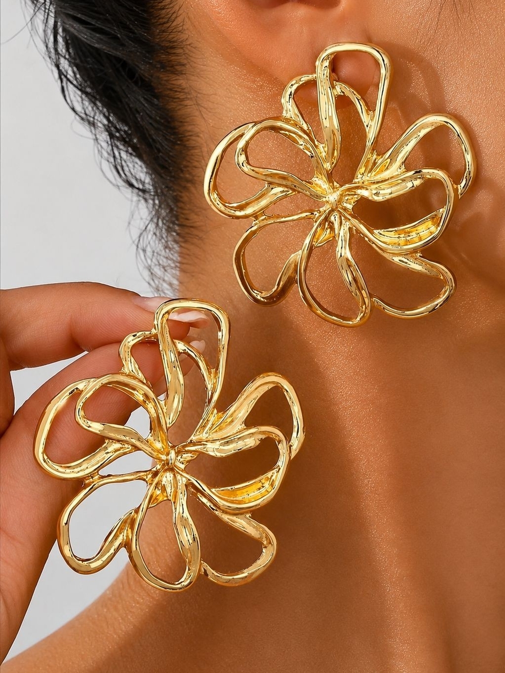 Polished Gold tone Floral Loop Earrings